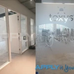 Custom frosted window film (AR01) with logo for the office hallway