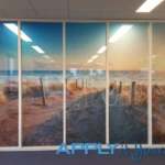 Bespoke printed frosted window film, across multiple windows, with beach, sand, sun, back, AR02