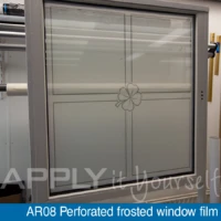 Perforated frosted window film with a custom printed design, front-side